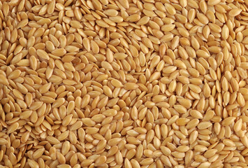 Golden flax seed texture. Natural background.