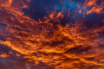 Colorful cloudy sky at sunset. Dramatic sunset sky with clouds. Sky texture, nature background.