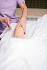 Fototapeta na wymiar Leg massage therapy Hands on leg making massage massage woman hands masseur to boot rubdown. Foot massage