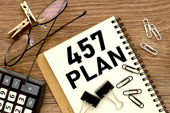 457 plan. text on white notepad paper on wood background