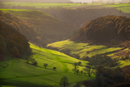View of valley in autumn under clear sky from a hiking path in Yorkshire England