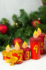 Handmade advent calendar with toilet paper tubes. Christmas candle craft. Seasonal eco activity for kids. Reuse concept
