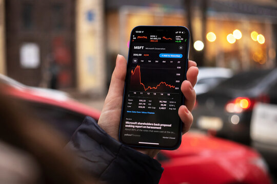 Kharkov, Ukraine - December 1, 2021: Microsoft MSFT stock trade. Financial graphs, investment, digital banking concept. Smartphone with stock market app in hand
