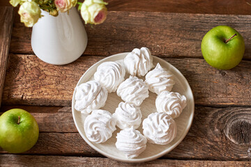 Russian homemade marshmallow, zefir, zephyr. Wooden background, side view, apple, flower