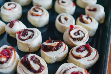 Making yeast buns with jam and chocolate. Handmade homemade cakes.