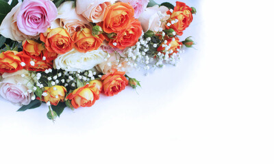 Fototapeta na wymiar A chic festive bouquet of light pink and orange roses on a white background. Background for greeting cards, invitations, greetings.