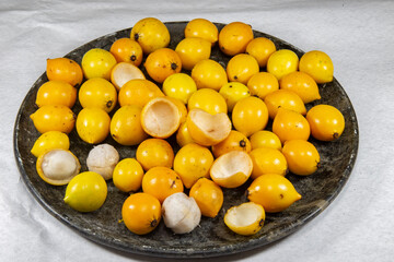 Ripe Achachairu fruit group ( Garcinia humilis ), in selective focus 