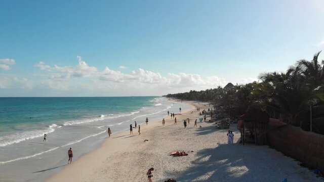 Top view of beautiful beach. Aerial drone shot of turquoise sea water at the beach. Luxury tropical resort with white sand. Aerial view. High quality FullHD footage