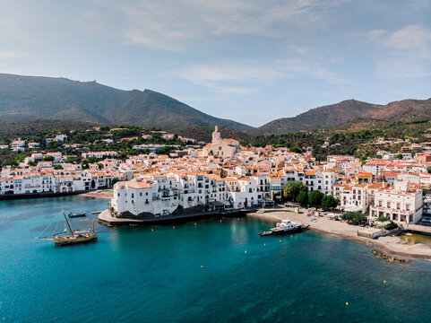 Drone shot Santa Maria de Cadaqu&eacute;s Drone view of a small village on the Costa Brava in Cadaqu&eacute;s. Boats in a rocky bay in Cadaques. View from the drone of the beach and the bay in Cadaques. 