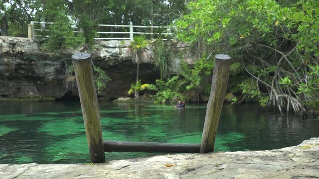 Beautiful cenote in, Mexico. Wooden stairs. High quality 4k footage