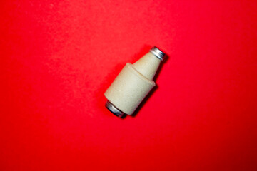 Old fuse on a red background