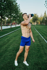 athletic man working out in the park crossfit exercise