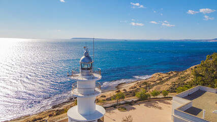 Faro del Cabo de las Huertas en Alicante , vista aérea en un día luminoso y con el mar peinado...