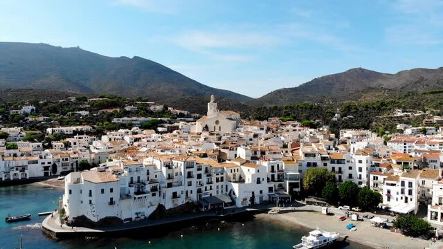 Drone shot Santa Maria de Cadaqu&eacute;s Drone view of a small village on the Costa Brava in Cadaqu&eacute;s. Boats in a rocky bay in Cadaques. View from the drone of the beach and the bay in Cadaques. 