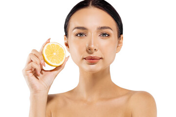 Woman and fruit portrait. model holds a juicy orange near her face and looks at the camera on a white background