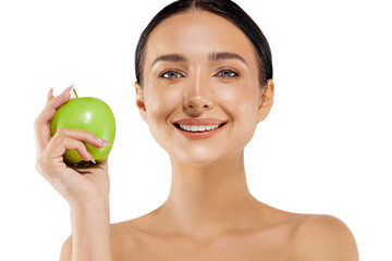 Portrait of a beautiful young woman with a perfect smile, smiling woman with healthy teeth holding a green apple