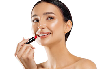 girl coloring lips with bright red lipstick on a white background. girl applying lipstick getting ready for a date