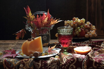 Still life with red wine, fruits and a bouquet of flowers