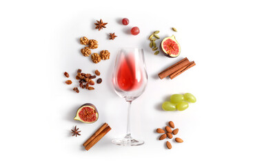 Fototapeta na wymiar Red wine and possibble ingredients of grape, cinnamon, figs isoalted on white background