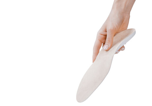 Orthopedic insole isolated on a white background. Medical insoles. Treatment and prevention of flat feet and foot diseases. Foot care, feet comfort. Wear comfortable shoes. Flat Feet Correction.
