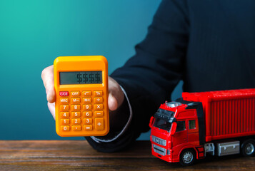 Businessman calculates the cost of shipping a container. Rising prices, global containers shortage...