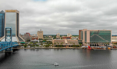 JACKSONVILLE, FL - APRIL 8, 2018: Aerial city view from the river on a cloudy day. The city is a major attraction in Florida