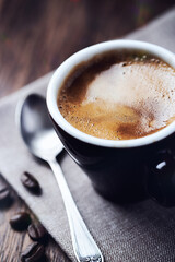 Cup of coffee on dark background. Close up.	