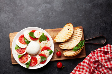 Caprese salad with mozzarella, basil and garden tomatoes