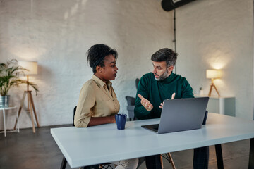 Couple having online conversation with psychotherapist.