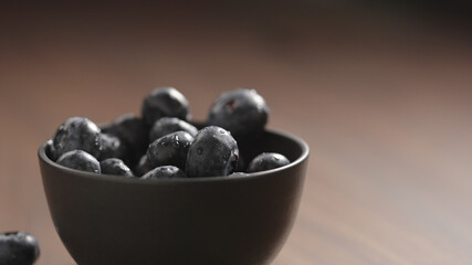 fresh washed blueberries in black bowl