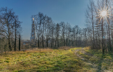 The restored Nikolo-Berlyukovsky Monastery on a sunny autumn day against the background of trees...