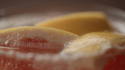 closeup shot of tonic with grapefruit slices