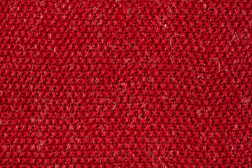 Handmade knitted fabric. Red interspersed with white thread