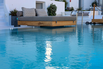 A wide bed by the pool, the perfect place for relaxing holidays