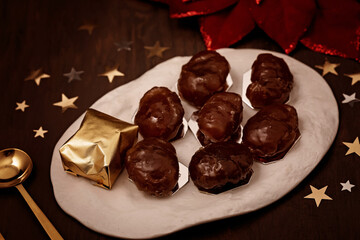 Glazed chestnuts,  traditional french sweets for winter holidays celebration. Cristmas dessert, festive dinner concept