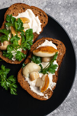 Sandwich with porcini mushrooms close-up top view
