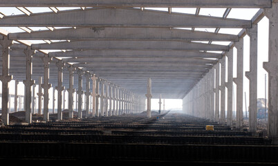 sunlight seeping through the newly built factory concrete