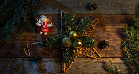 Christmas decoration.
Decoration for Christmas. Christmas balls on boards spread over a braided star.
