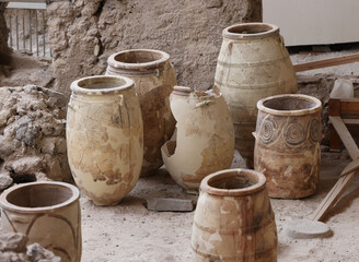  Recovered ancient pottery in prehistoric town of Akrotiri, excavation site of a Minoan Bronze Age...