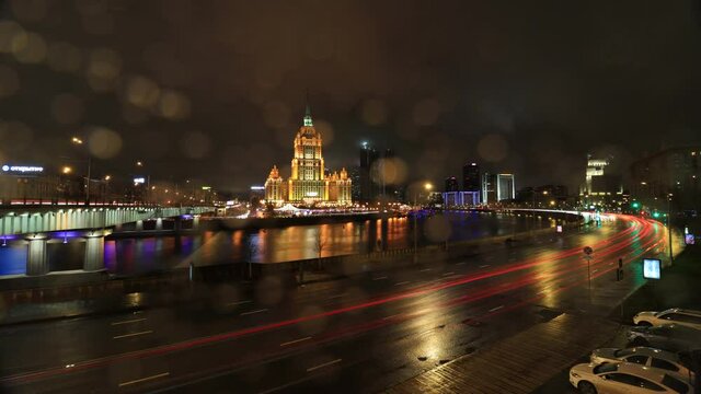timelapse with tracers of traffic at night on the Krasnopresnenskya embankment and Hotel Ukraina in Moscow, Russia