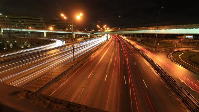 timelapse with tracers of traffic at night on the MKAD highway Kashirskoe highway at the intersection with Mozhayskoe highway, Moscow, Russia