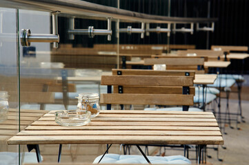 Empty cafe seats and chairs outside in london on sunny day.