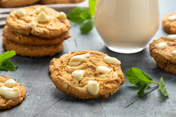 White Chocolate Caramel soft baked cookies served with glass of milk