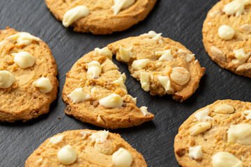 White Chocolate Caramel soft baked cookies served with glass of milk