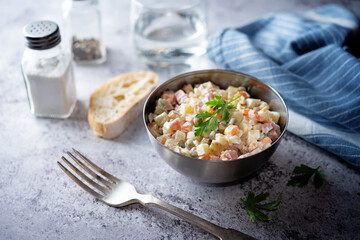 Potatoes green peas carrots sausage salad with mayonnaise