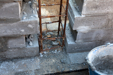 Brick foundation wall made of blocks and cement. Construction of a modern home