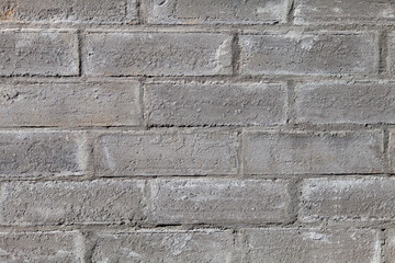 close-up of a brick foundation wall made of blocks and cement. Construction of a modern home