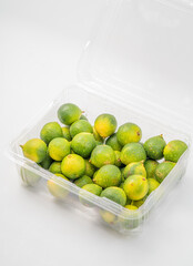 Fresh little limes on pure white background
