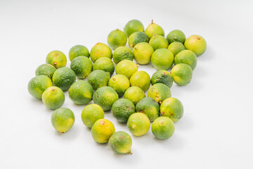Fresh little limes on pure white background