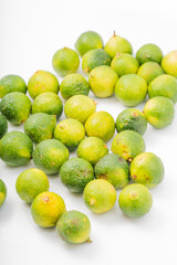 Fresh little limes on pure white background
